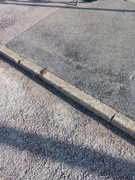 The photo for No dropped kerb onto cycle path at Burgess Road.
