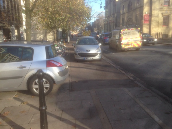 The photo for Pavement parking on East Road near police station - yellow lines needed.