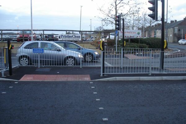 The photo for Cyclists dismount for Tesco car park traffic.